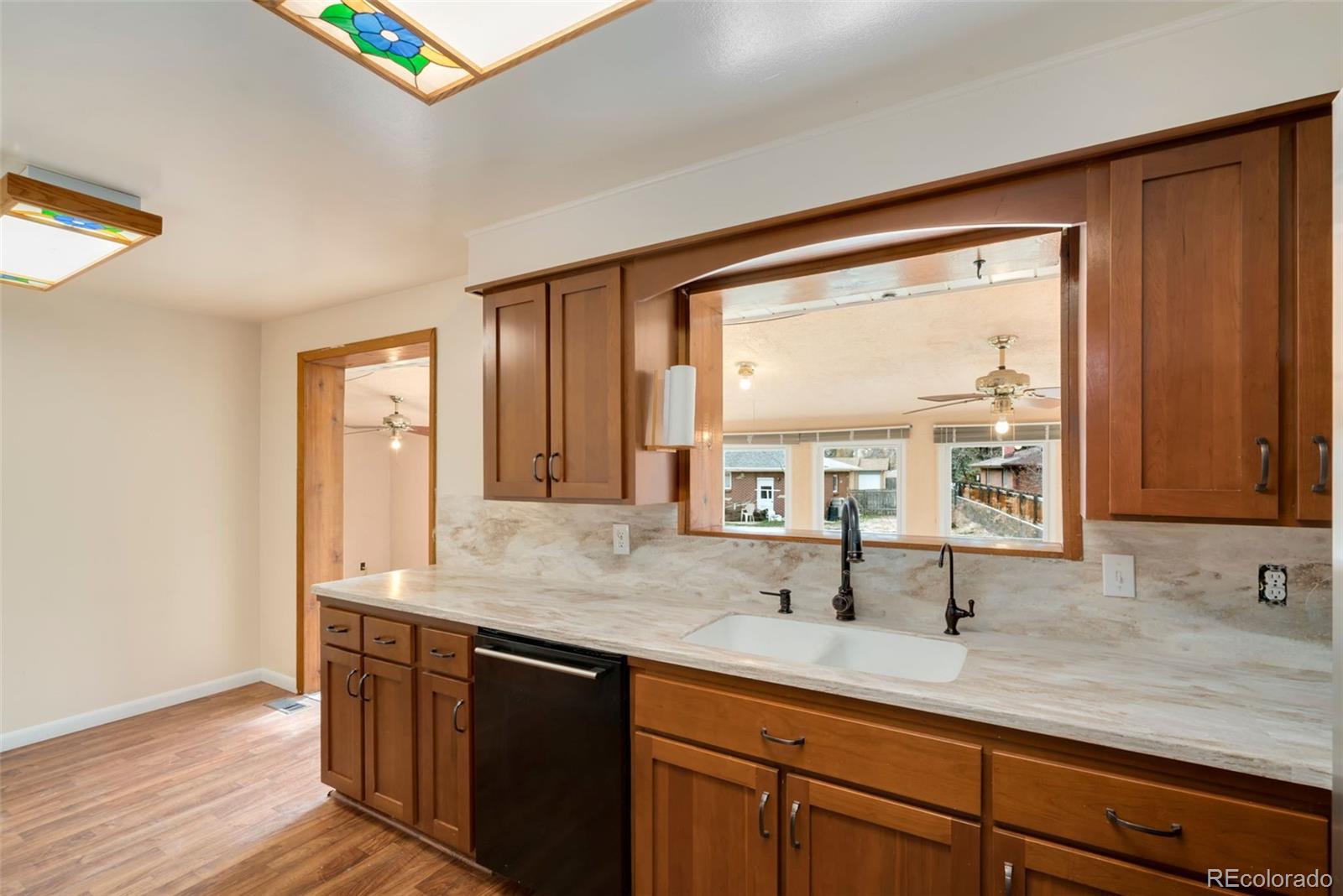 7101 Beach Street Westminster, CO 80030 - Photo 5 of 18 a bathroom with a sink and a large mirror