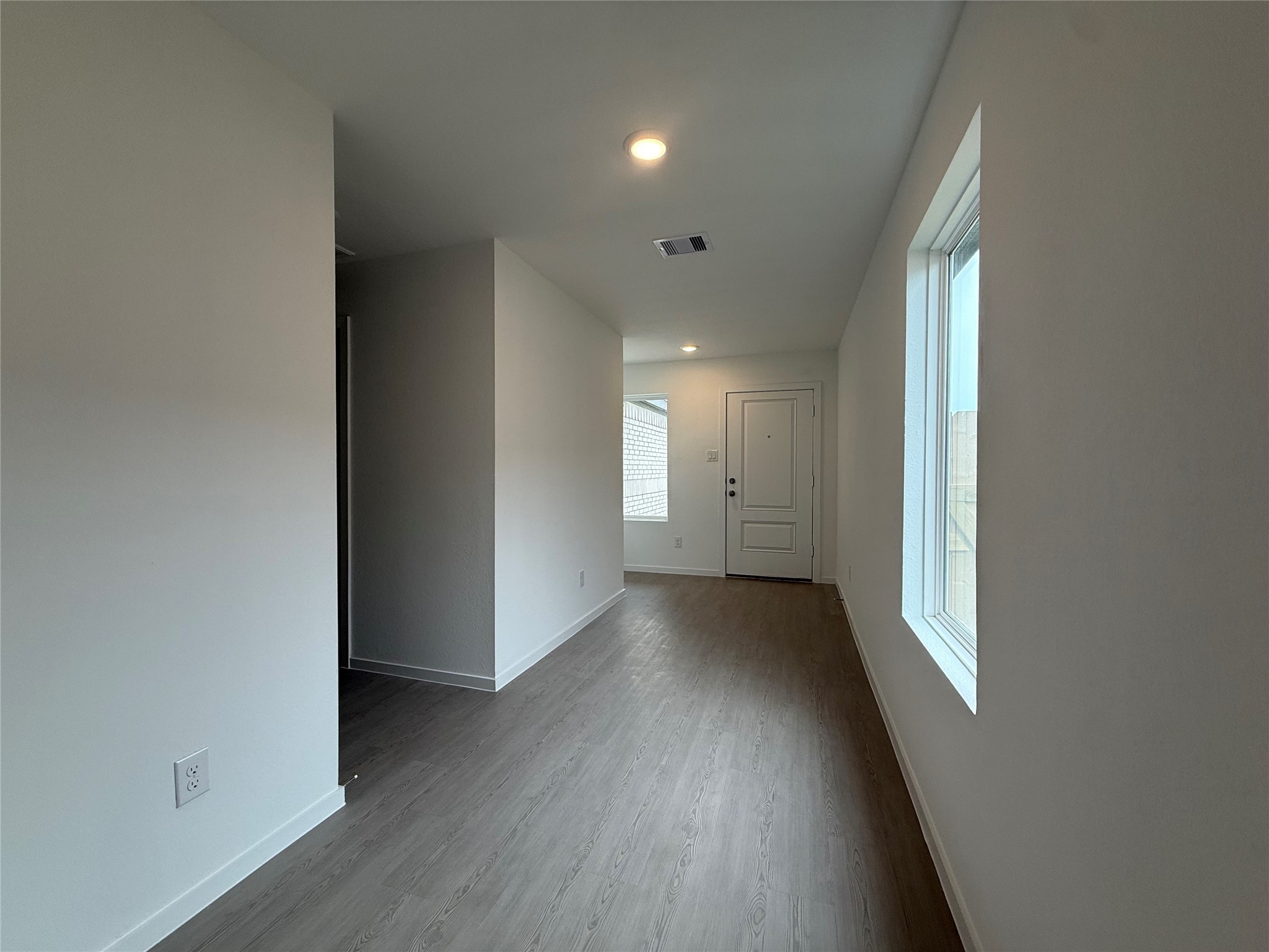 12915 Shells Lane Crosby, TX 77532 - Photo 14 of 20 wooden floor in an empty room with a window