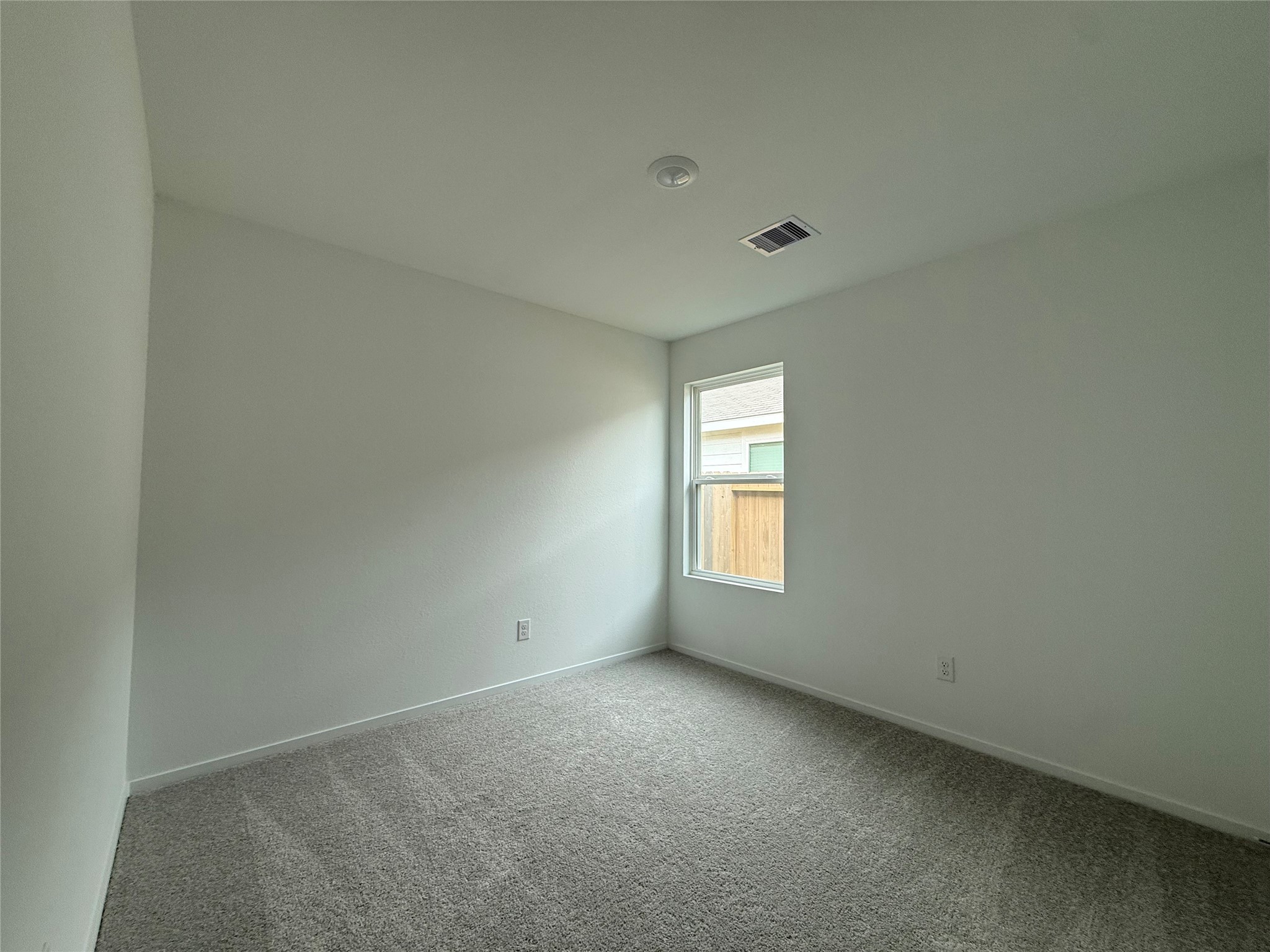12915 Shells Lane Crosby, TX 77532 - Photo 17 of 20 a view of an empty room with a window