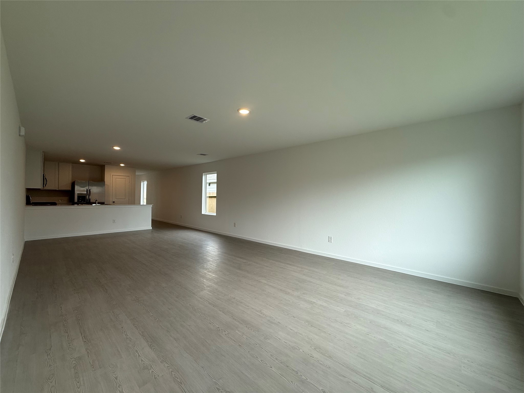 12915 Shells Lane Crosby, TX 77532 - Photo 8 of 20 an empty room with a empty space and a window