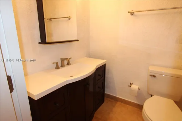 a view of a patio with a table and a chair