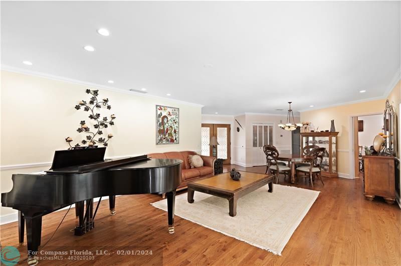 1129 Southwest 2nd Street Boca Raton, FL 33486 - Photo 11 of 39 a living room with furniture and a wooden floor