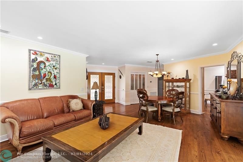 1129 Southwest 2nd Street Boca Raton, FL 33486 - Photo 12 of 39 a living room with furniture kitchen view and a large window