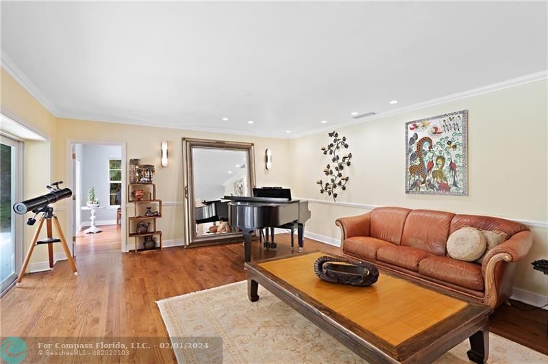 1129 Southwest 2nd Street Boca Raton, FL 33486 - Photo 13 of 39 a living room with furniture and wooden floor