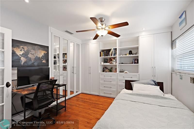 1129 Southwest 2nd Street Boca Raton, FL 33486 - Photo 16 of 39 a bedroom with furniture and a flat screen tv