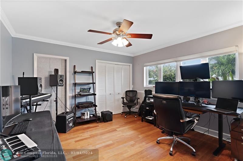 1129 Southwest 2nd Street Boca Raton, FL 33486 - Photo 19 of 39 a view of a workspace with furniture and a window