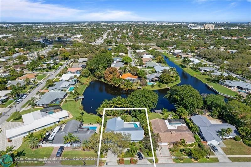 1129 Southwest 2nd Street Boca Raton, FL 33486 - Photo 31 of 39 an aerial view of residential houses with outdoor space and trees