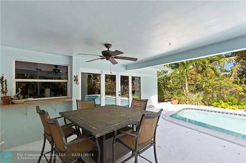 1129 Southwest 2nd Street Boca Raton, FL 33486 - Photo 32 of 39 a view of a dining room with furniture window and outside view