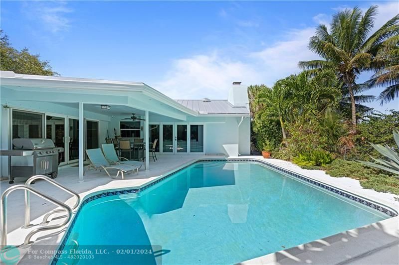 1129 Southwest 2nd Street Boca Raton, FL 33486 - Photo 33 of 39 a view of a patio with table and chairs and potted plants