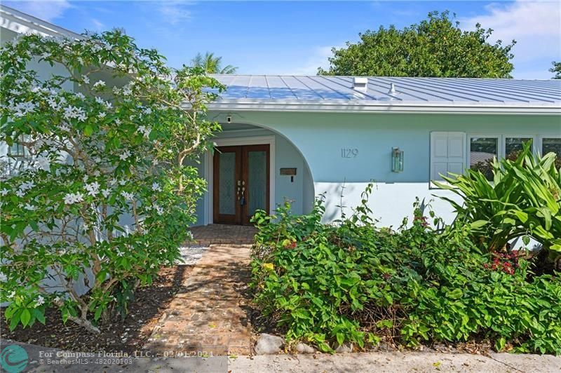 1129 Southwest 2nd Street Boca Raton, FL 33486 - Photo 36 of 39 a front view of a house with garden