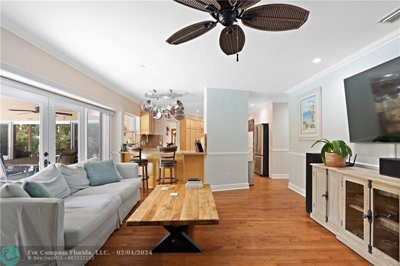 1129 Southwest 2nd Street Boca Raton, FL 33486 - Photo 9 of 39 a living room with furniture and a flat screen tv