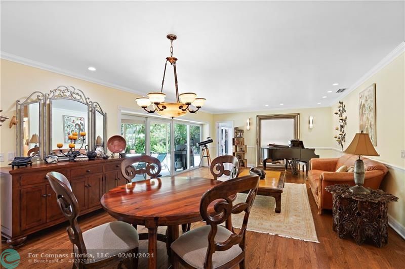 1129 Southwest 2nd Street Boca Raton, FL 33486 - Photo 10 of 39 a view of a dining room with furniture window and wooden floor