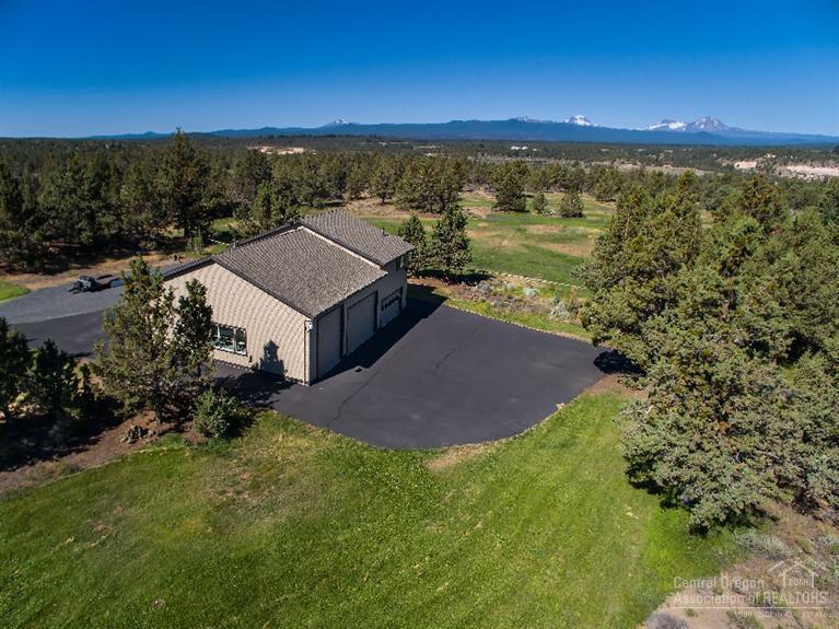 64245 Schibel Road Bend, OR 97703 - Photo 18 of 18 a view of a lake with a mountain in the background