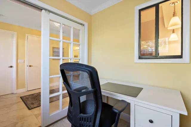 a spacious bedroom with a bed and a dresser