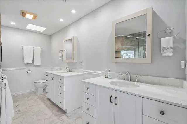 an aerial view of a house with a garden and swimming pool