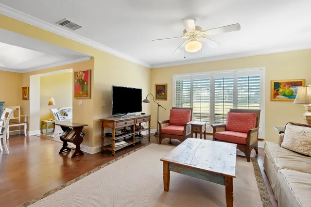 a view of a living room and floor to ceiling window