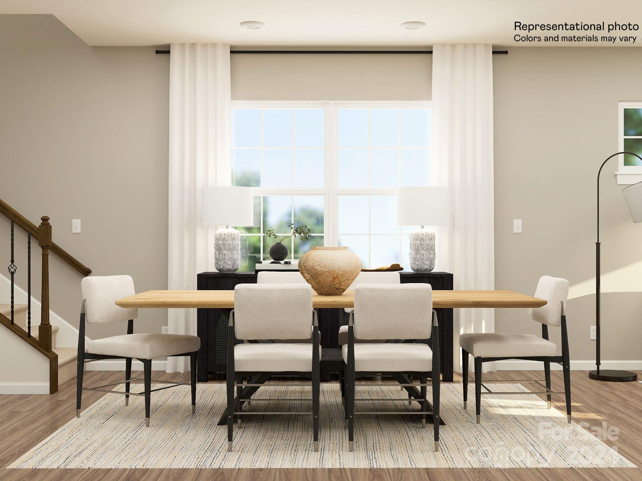 5681 Soft Shell Drive, Unit 370 Lancaster, SC 29720 - Photo 13 of 22 a dining room with furniture a rug and wooden floor