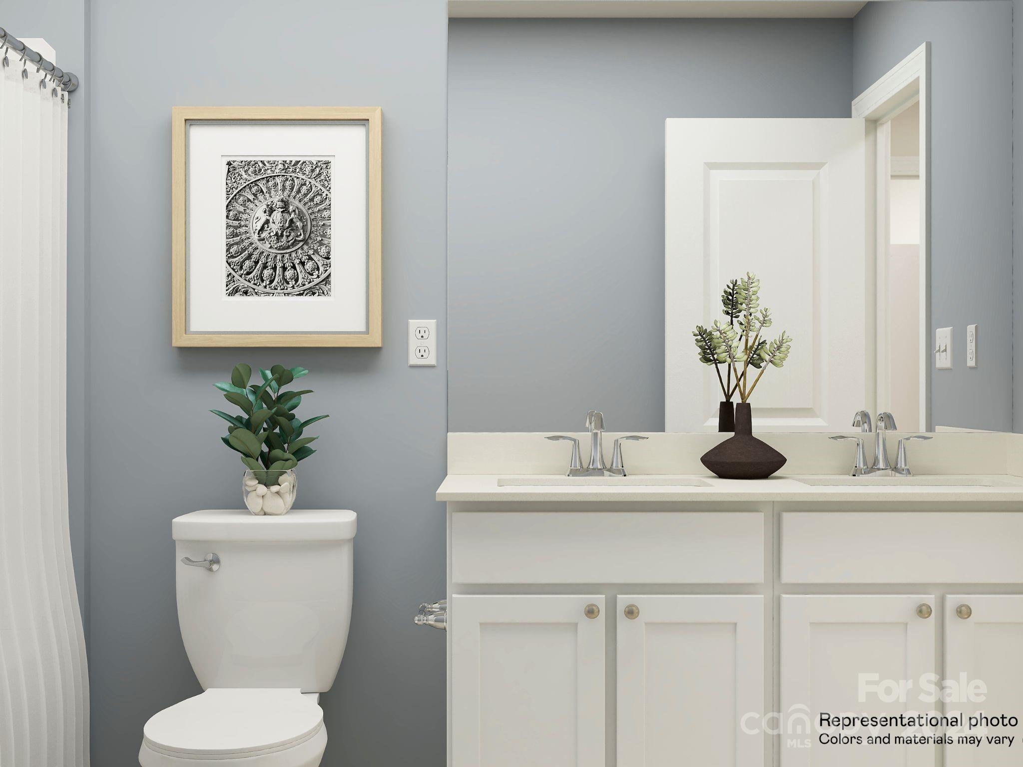 5681 Soft Shell Drive, Unit 370 Lancaster, SC 29720 - Photo 5 of 22 a bathroom with a toilet a sink and mirror