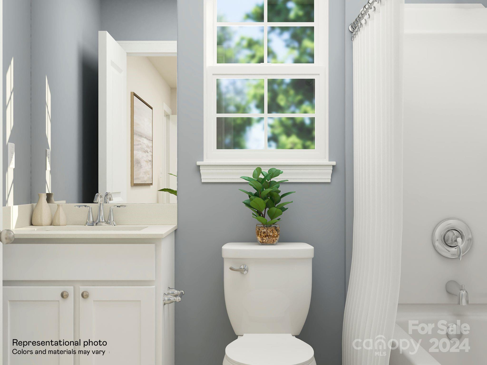 5681 Soft Shell Drive, Unit 370 Lancaster, SC 29720 - Photo 6 of 22 a bathroom with a toilet sink and mirror