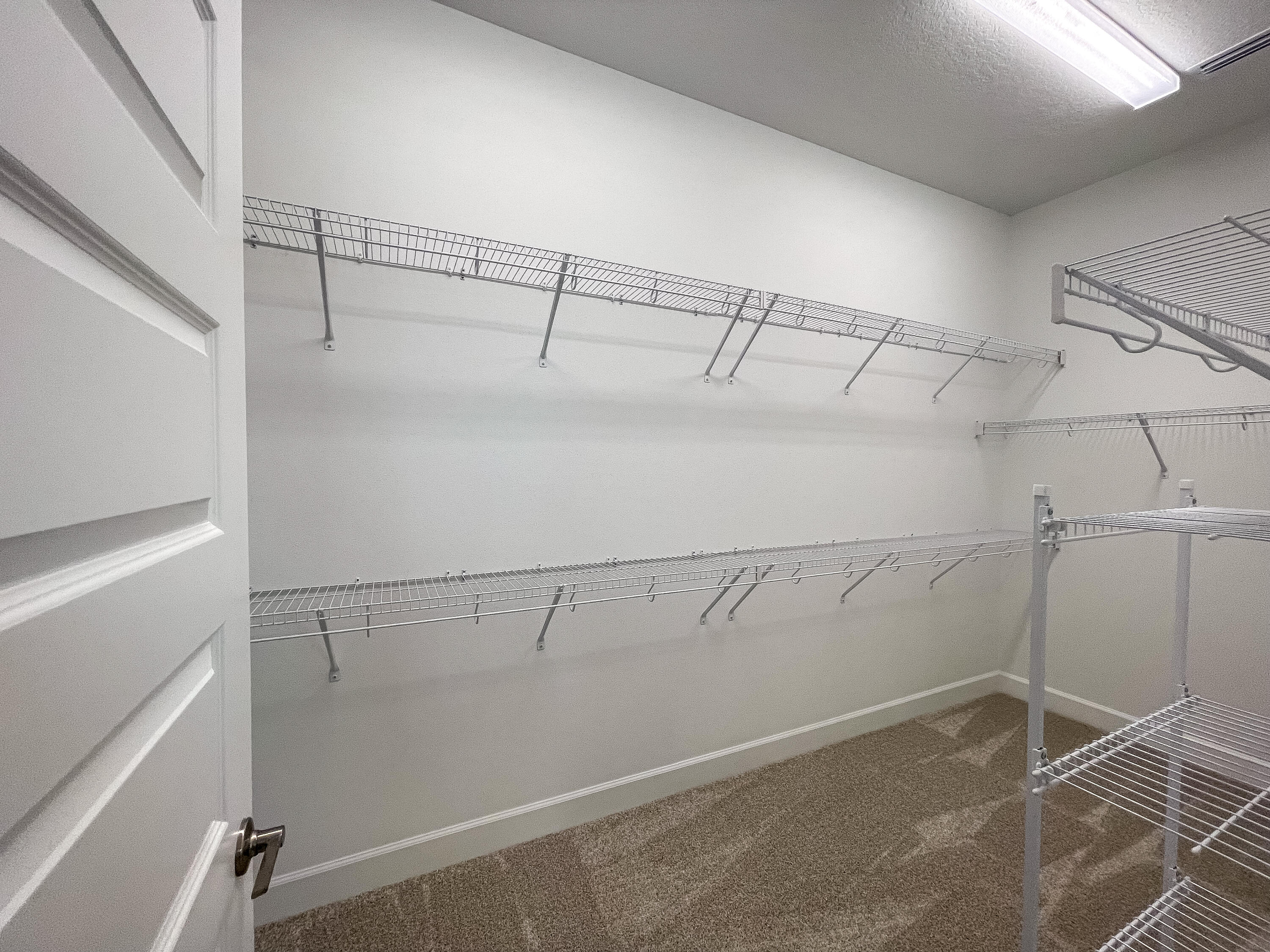 7809 Cache Crk Lane Melbourne, FL 32940 - Photo 13 of 35 a view of a room with racks on the wall