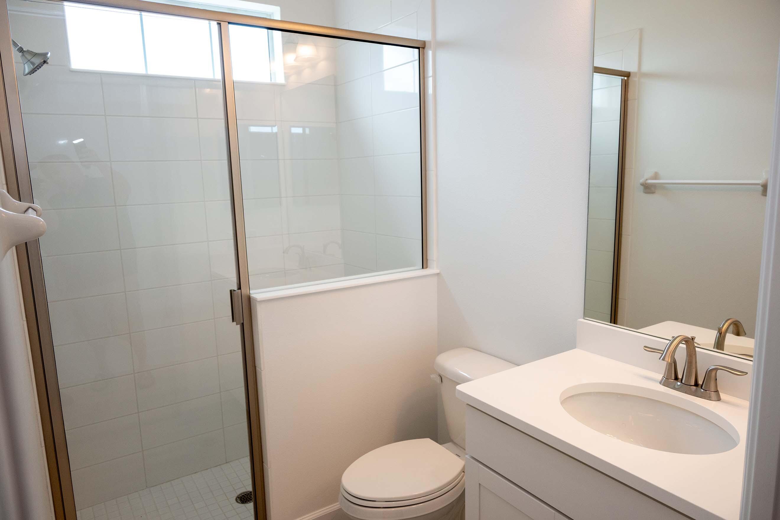 7809 Cache Crk Lane Melbourne, FL 32940 - Photo 18 of 35 a bathroom with a sink toilet and shower