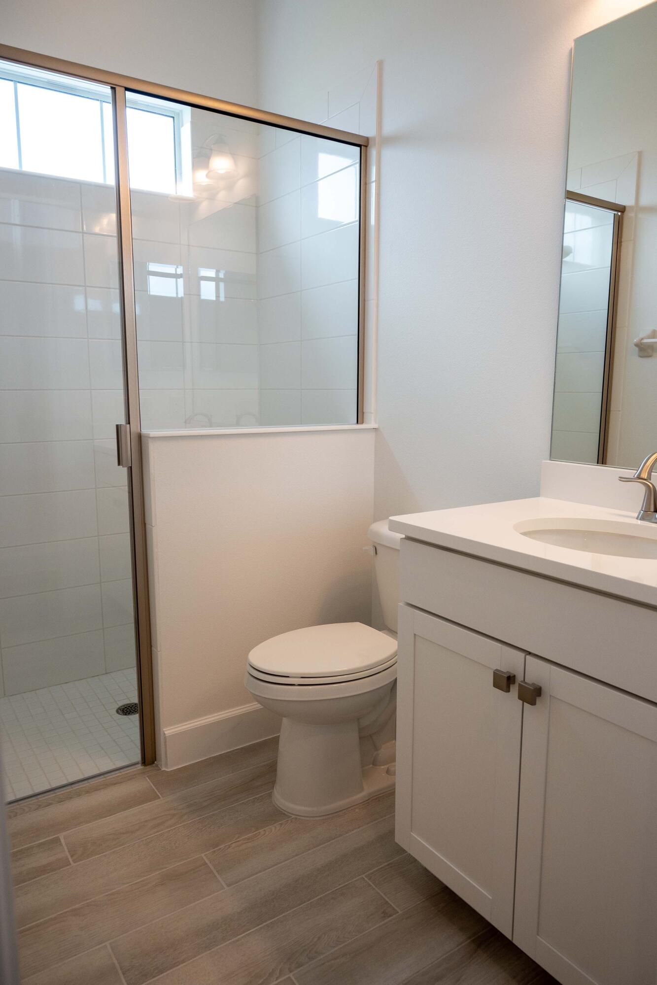 7809 Cache Crk Lane Melbourne, FL 32940 - Photo 19 of 35 a bathroom with a toilet and a shower