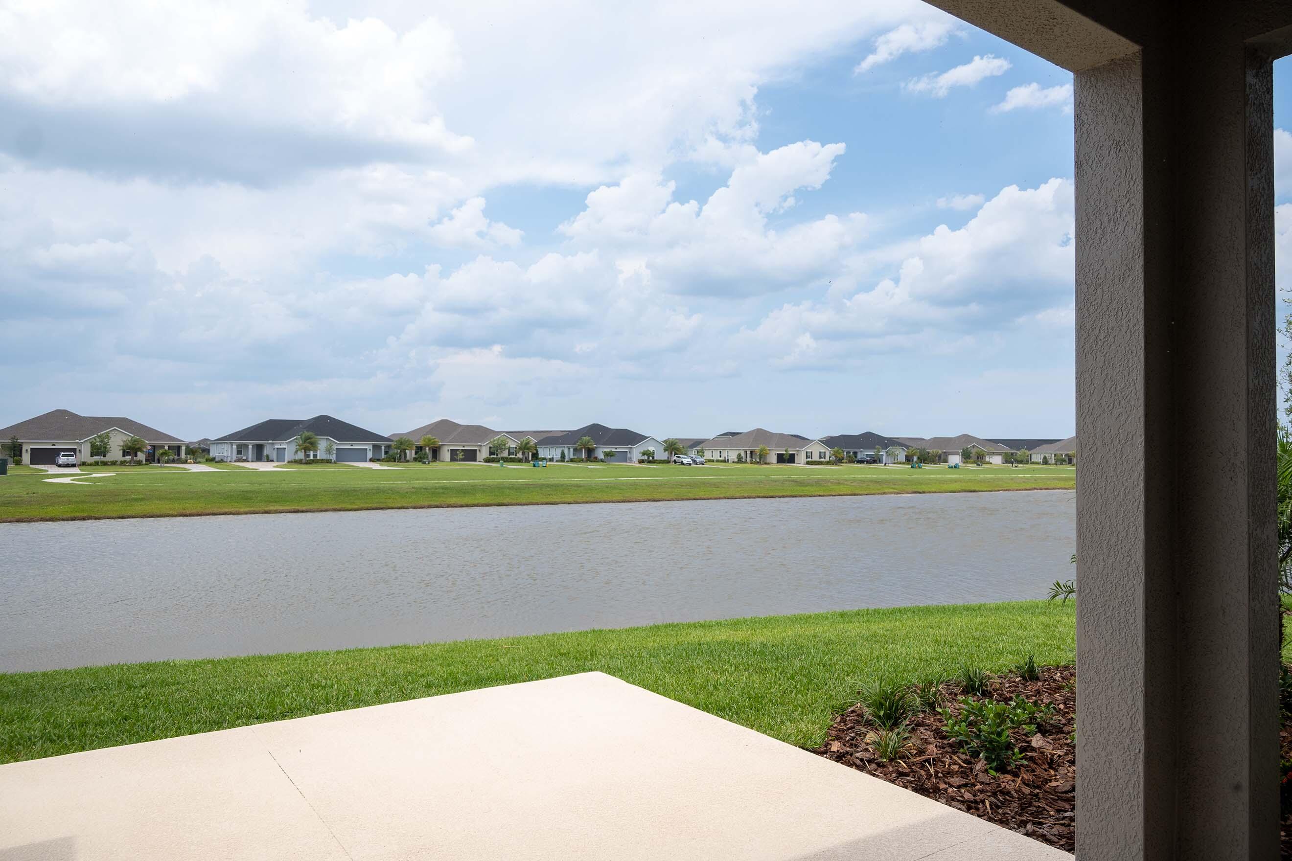 7809 Cache Crk Lane Melbourne, FL 32940 - Photo 2 of 35 a view of lake with mountain in the background