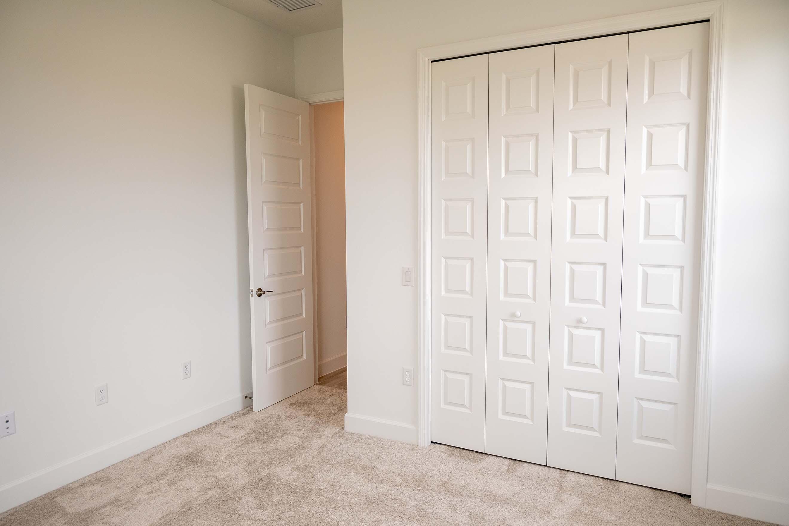 7809 Cache Crk Lane Melbourne, FL 32940 - Photo 21 of 35 an empty room with a wooden door