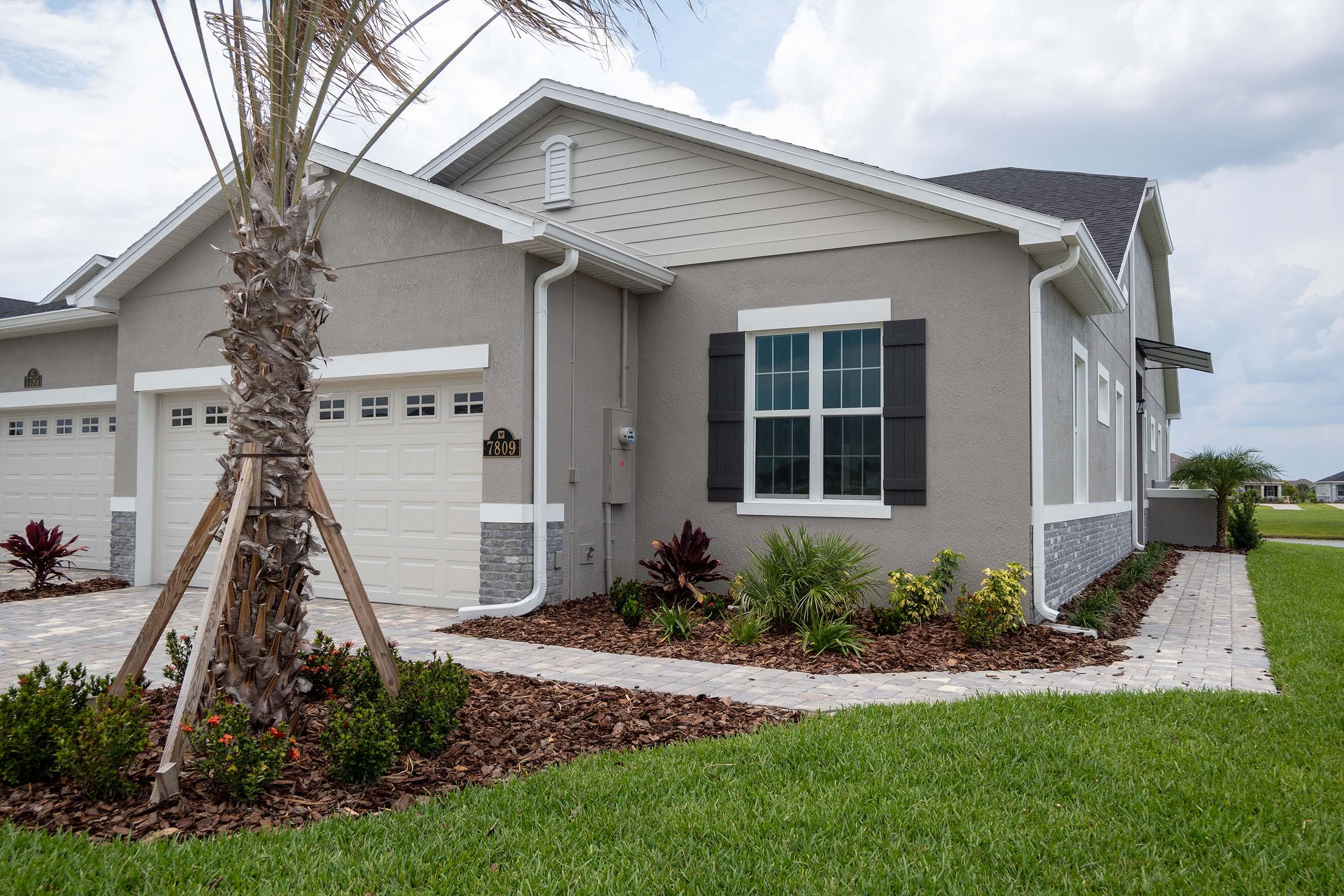 7809 Cache Crk Lane Melbourne, FL 32940 - Photo 25 of 35 a view of a house with backyard and garden