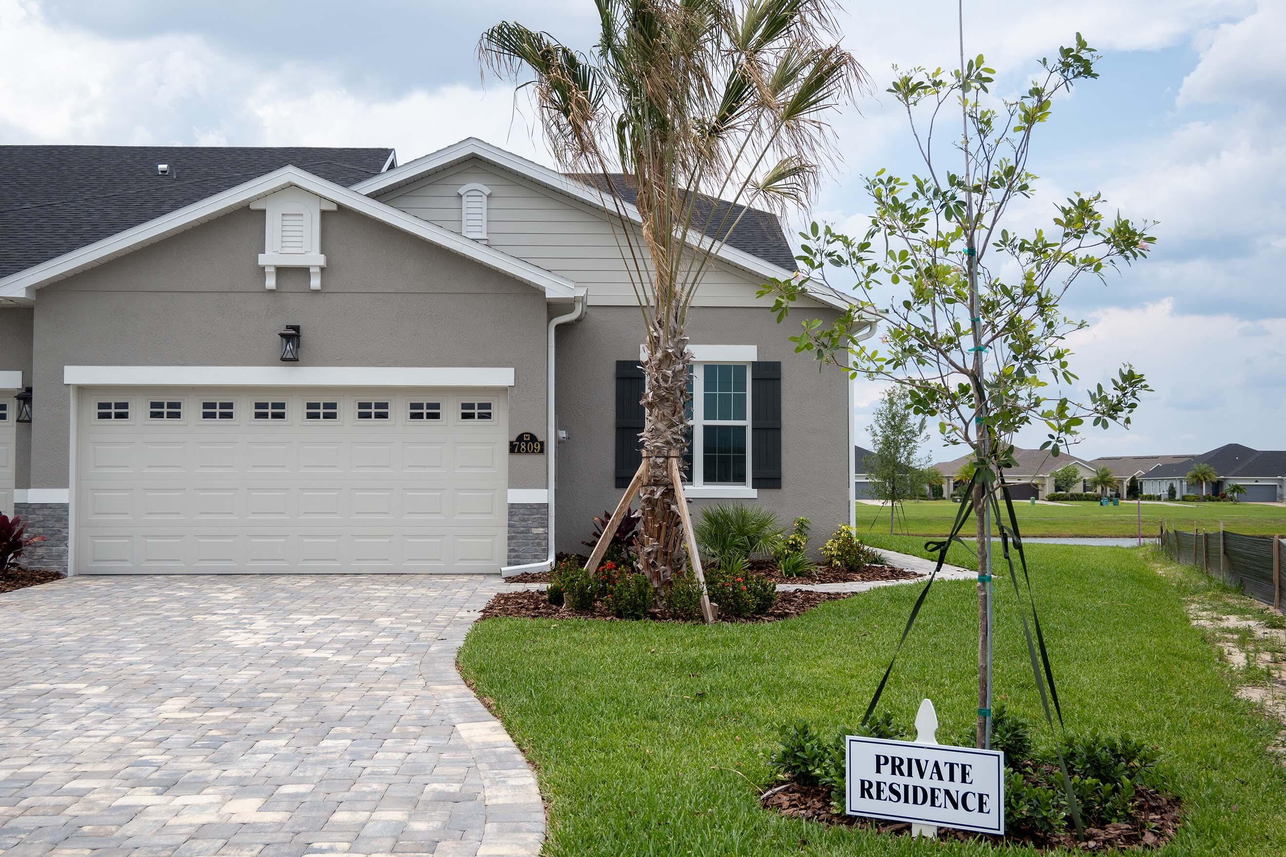 7809 Cache Crk Lane Melbourne, FL 32940 - Photo 26 of 35 a front view of a house with a yard