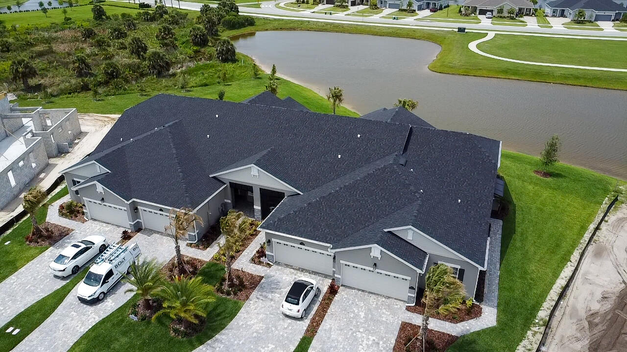7809 Cache Crk Lane Melbourne, FL 32940 - Photo 30 of 35 an aerial view of a house with a lake view