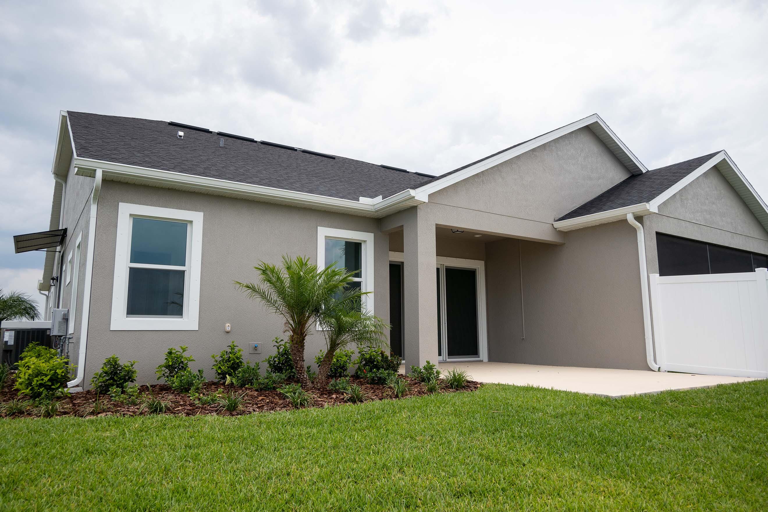 7809 Cache Crk Lane Melbourne, FL 32940 - Photo 31 of 35 a front view of house with yard and green space