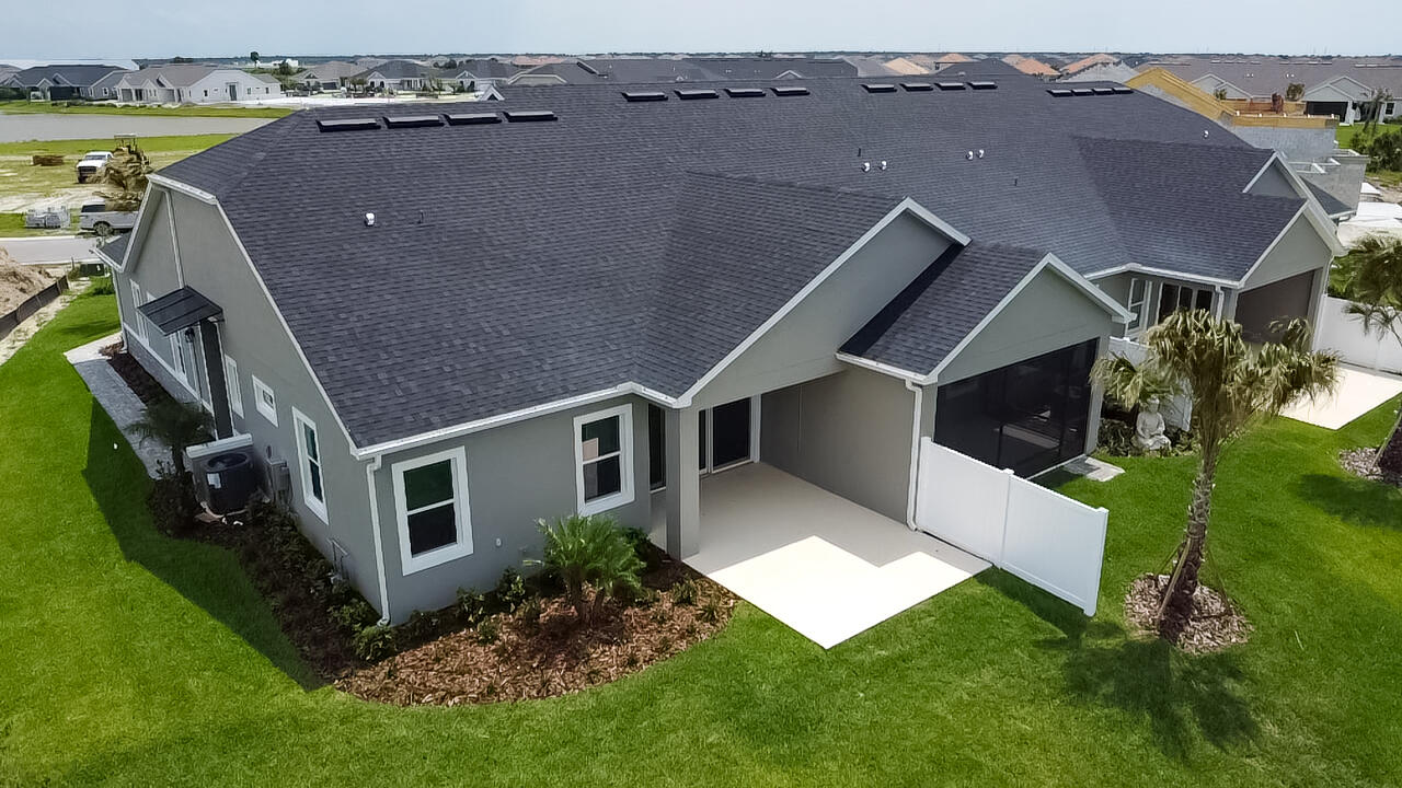7809 Cache Crk Lane Melbourne, FL 32940 - Photo 33 of 35 an aerial view of a house with a yard