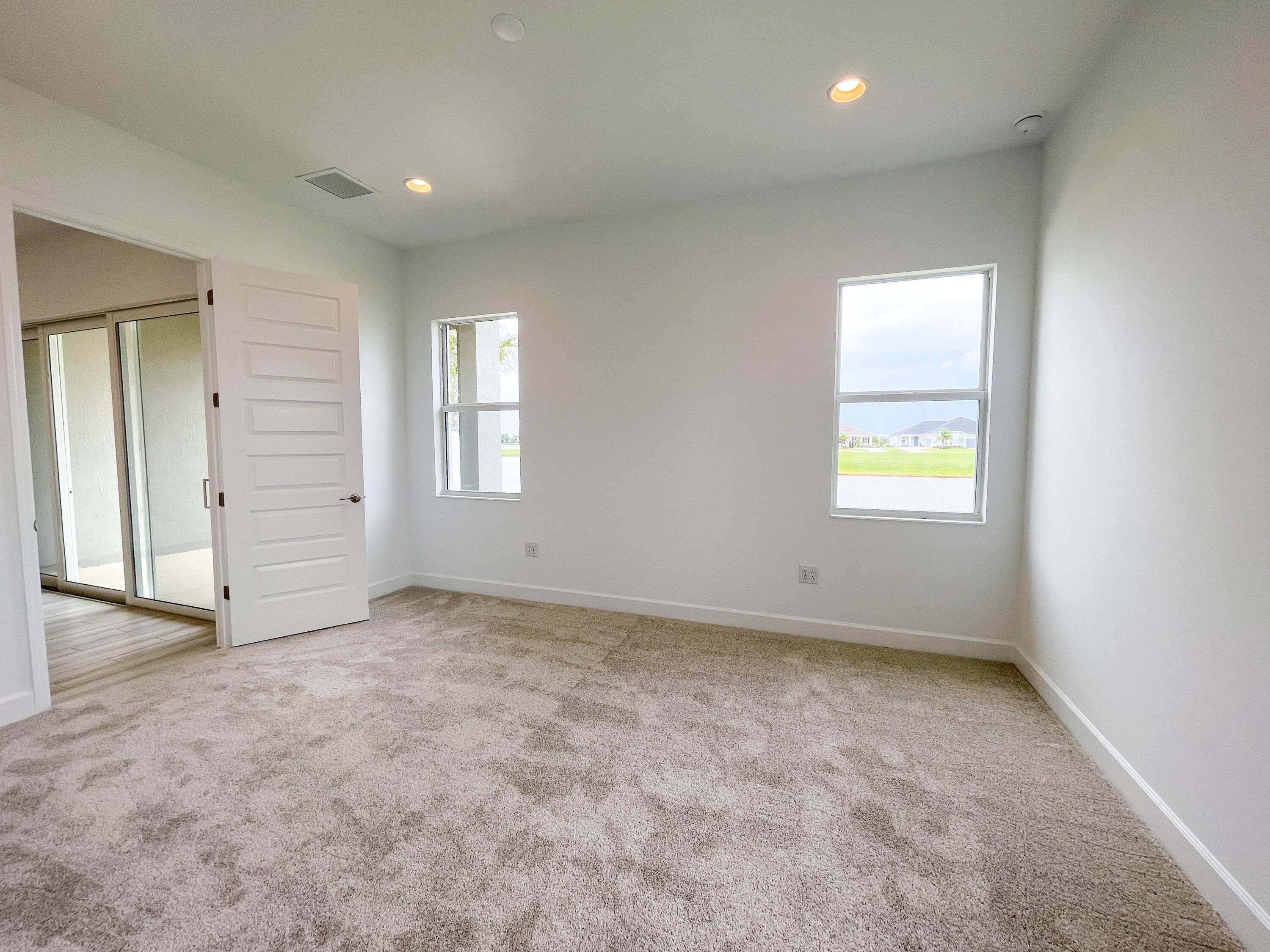 7809 Cache Crk Lane Melbourne, FL 32940 - Photo 8 of 35 an empty room with windows