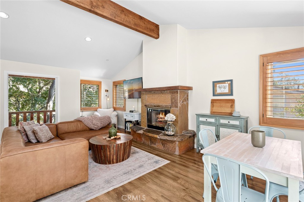 2072 Hidden Valley Canyon Road Laguna Beach, CA 92651 - Photo 1 of 26 a living room with furniture and a fireplace