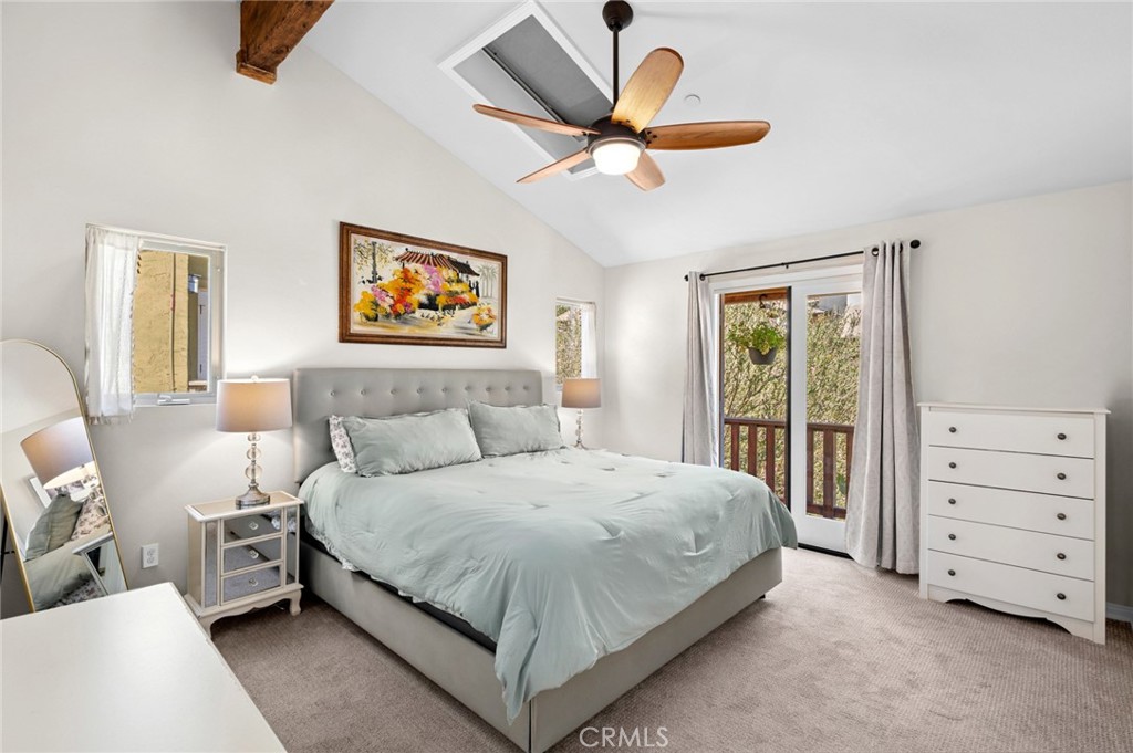 2072 Hidden Valley Canyon Road Laguna Beach, CA 92651 - Photo 12 of 26 a bedroom with a bed a window and a couch