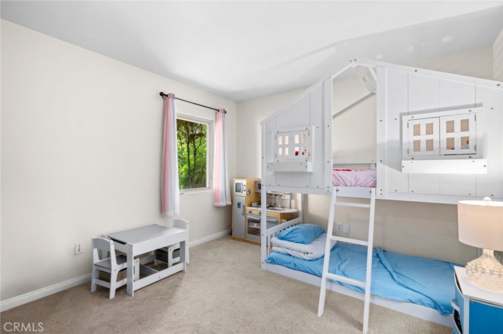 2072 Hidden Valley Canyon Road Laguna Beach, CA 92651 - Photo 16 of 26 a room with furniture and a window