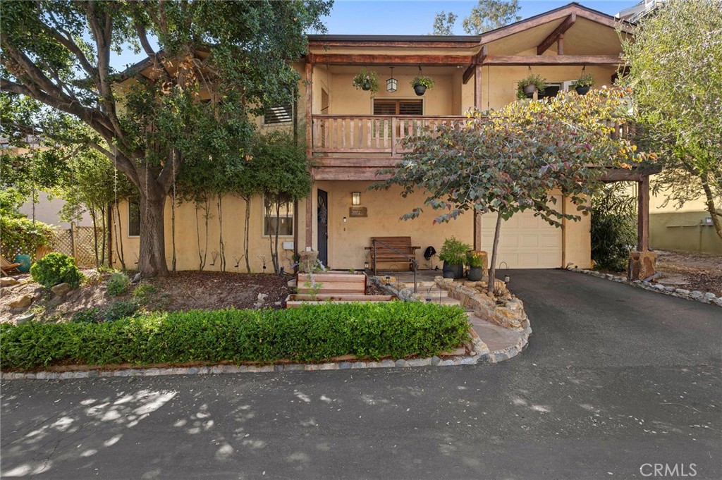 2072 Hidden Valley Canyon Road Laguna Beach, CA 92651 - Photo 23 of 26 a front view of a house with a garden