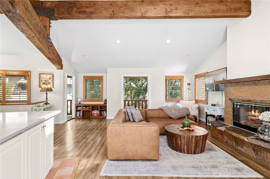 2072 Hidden Valley Canyon Road Laguna Beach, CA 92651 - Photo 3 of 26 a living room with furniture and a fireplace