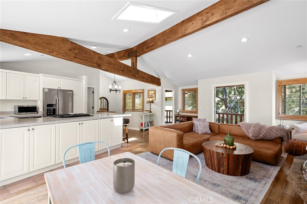 2072 Hidden Valley Canyon Road Laguna Beach, CA 92651 - Photo 4 of 26 a living room with furniture a large window and kitchen view