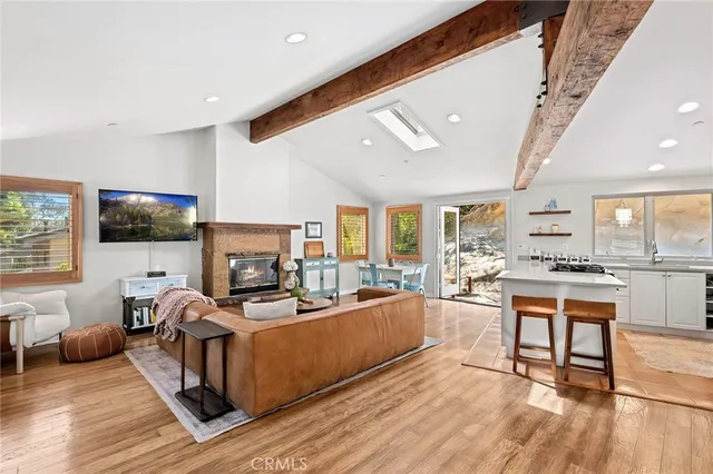 a living room with fireplace furniture and a flat screen tv