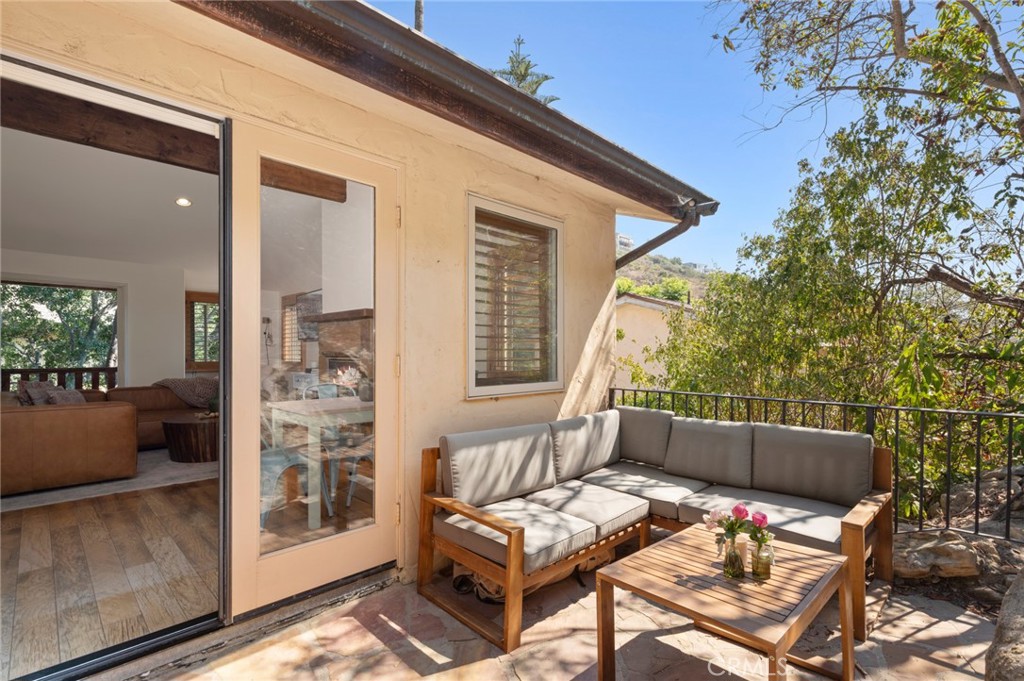 2072 Hidden Valley Canyon Road Laguna Beach, CA 92651 - Photo 7 of 26 a outdoor living space with furniture and garden view