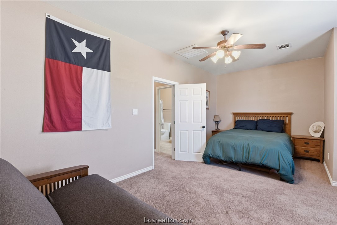 1425 West Villa Maria Road, Unit 605 Bryan, TX 77801 - Photo 23 of 46 Carpeted bedroom with baseboards and ceiling fan