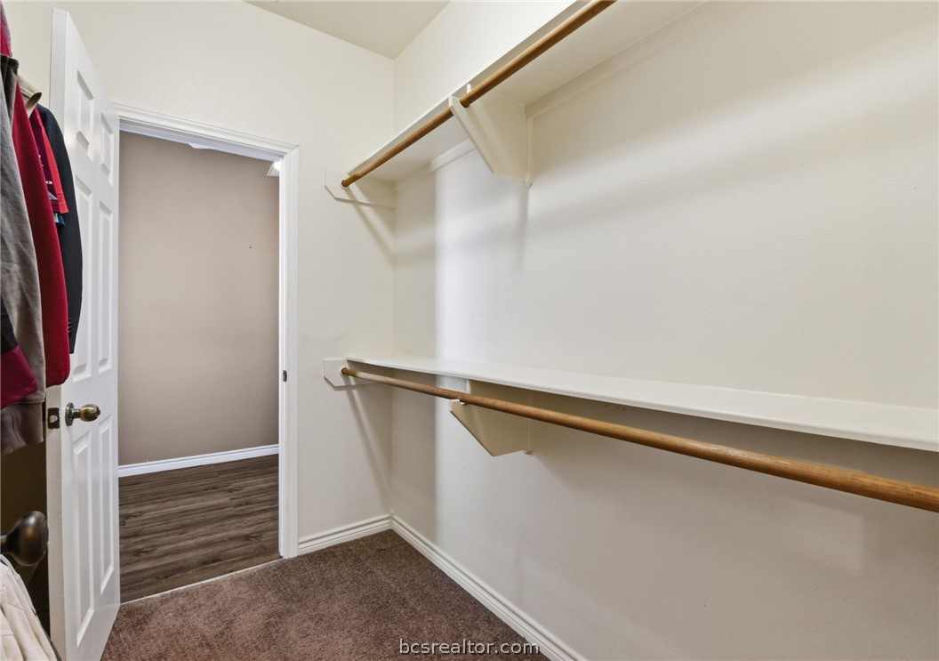 1425 West Villa Maria Road, Unit 605 Bryan, TX 77801 - Photo 31 of 46 Walk in closet featuring dark carpet