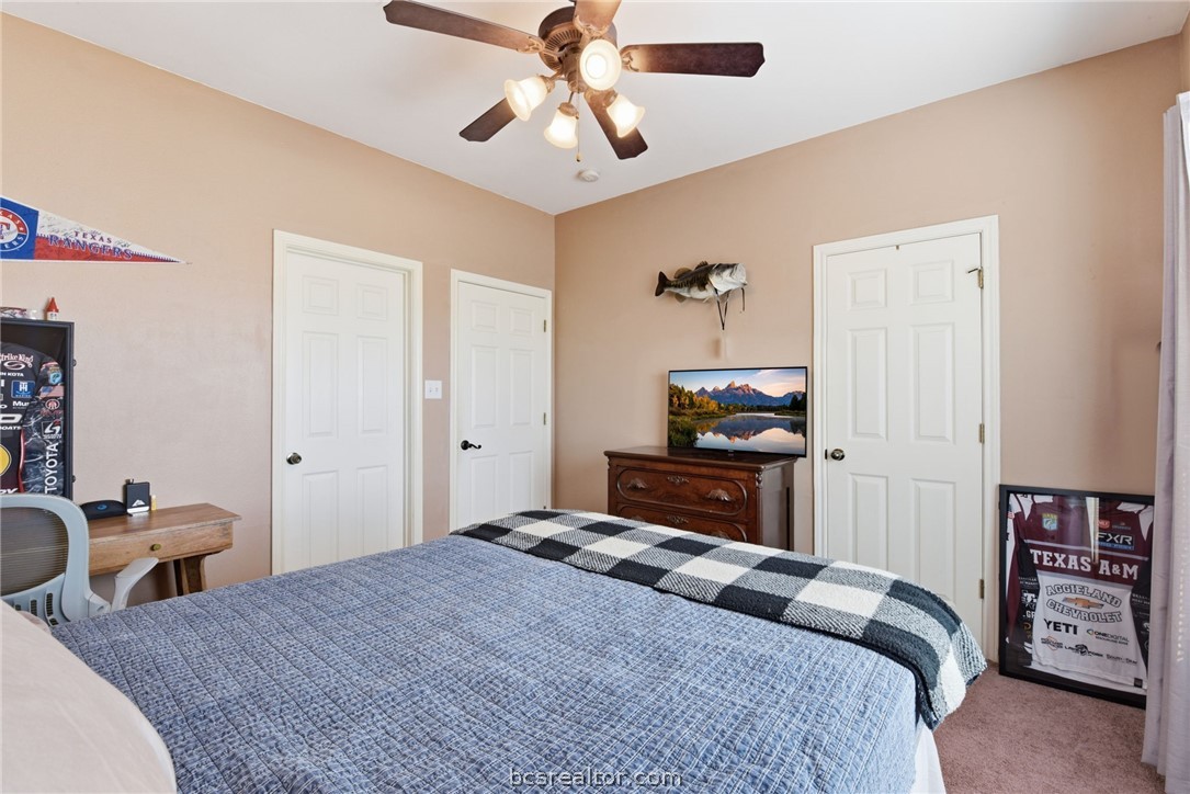 1425 West Villa Maria Road, Unit 605 Bryan, TX 77801 - Photo 34 of 46 Carpeted bedroom with ceiling fan
