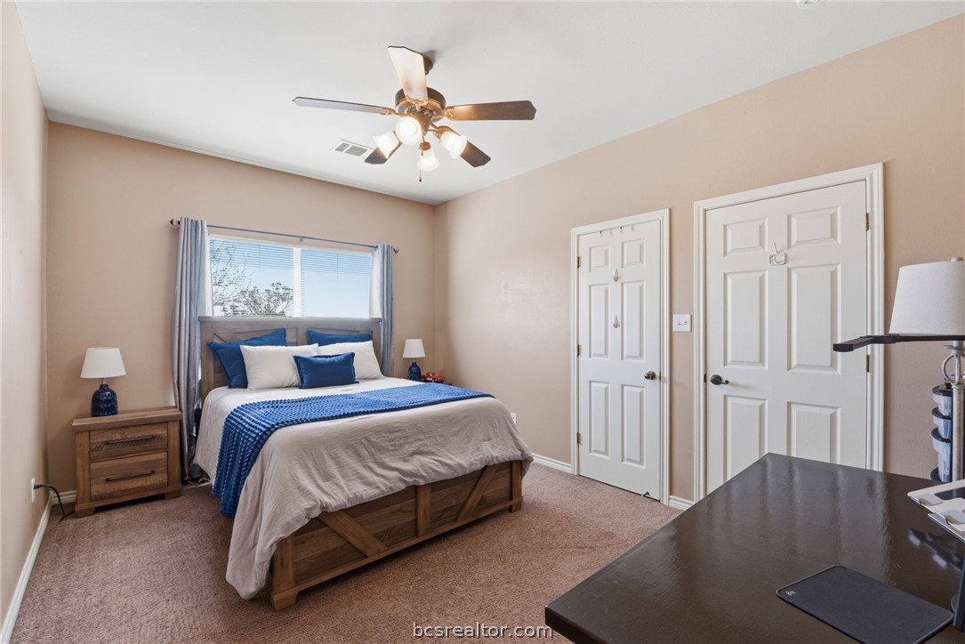 1425 West Villa Maria Road, Unit 605 Bryan, TX 77801 - Photo 36 of 46 Carpeted bedroom with a ceiling fan and baseboards