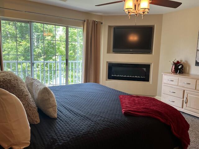530 Spring Creek Road, Unit 57 Branson, MO 65616 - Photo 10 of 19 bedroom with custom tv and fireplace