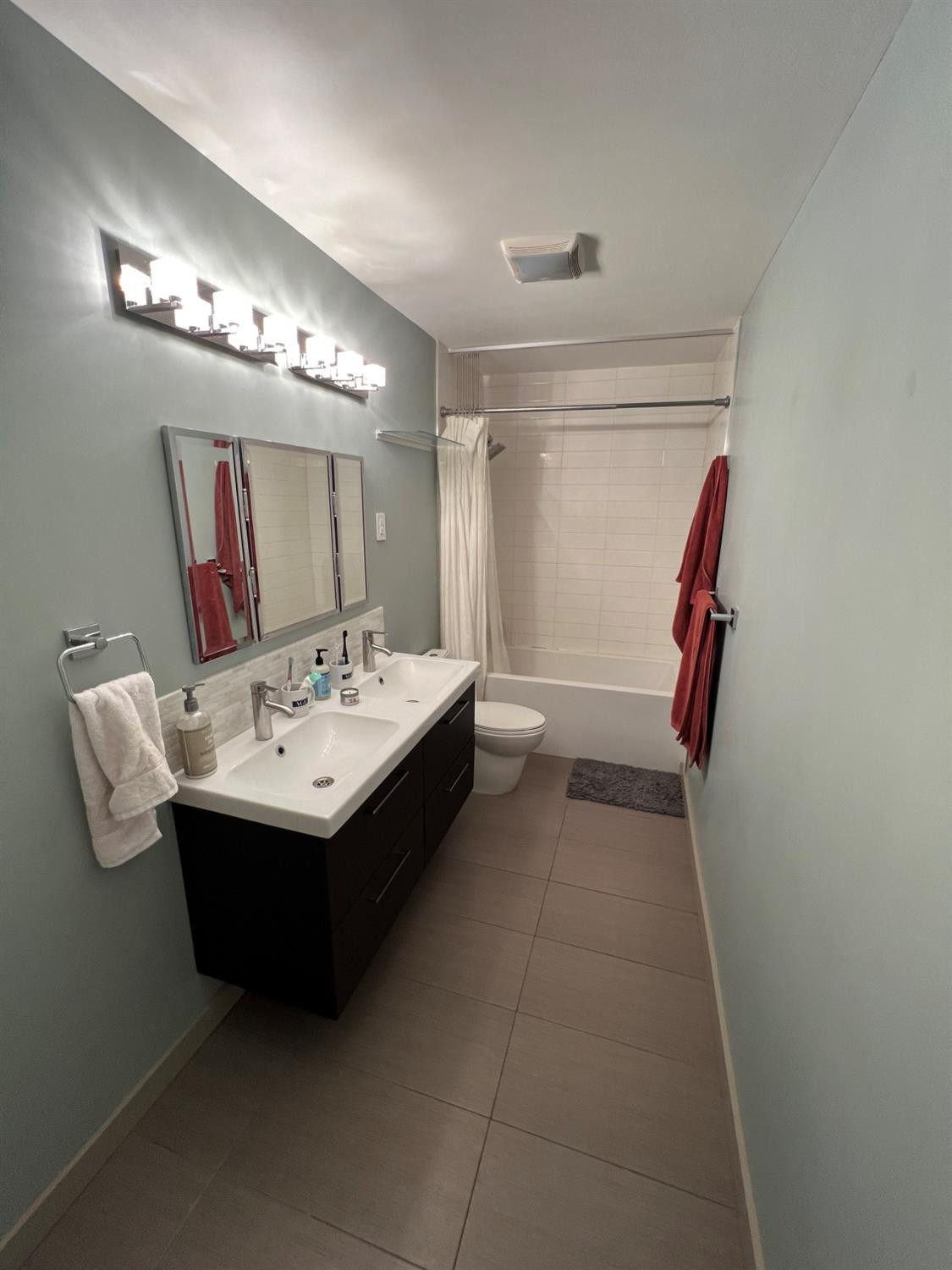 2509 29th Street Lubbock, TX 79410 - Photo 4 of 10 a bathroom with a sink and mirror