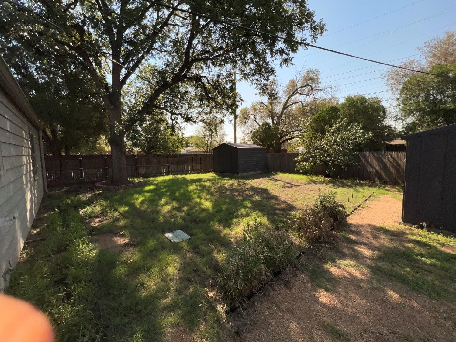 2509 29th Street Lubbock, TX 79410 - Photo 8 of 10 a view of yard with tree in back