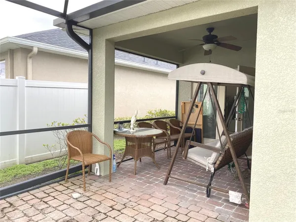 a chair and table in a balcony